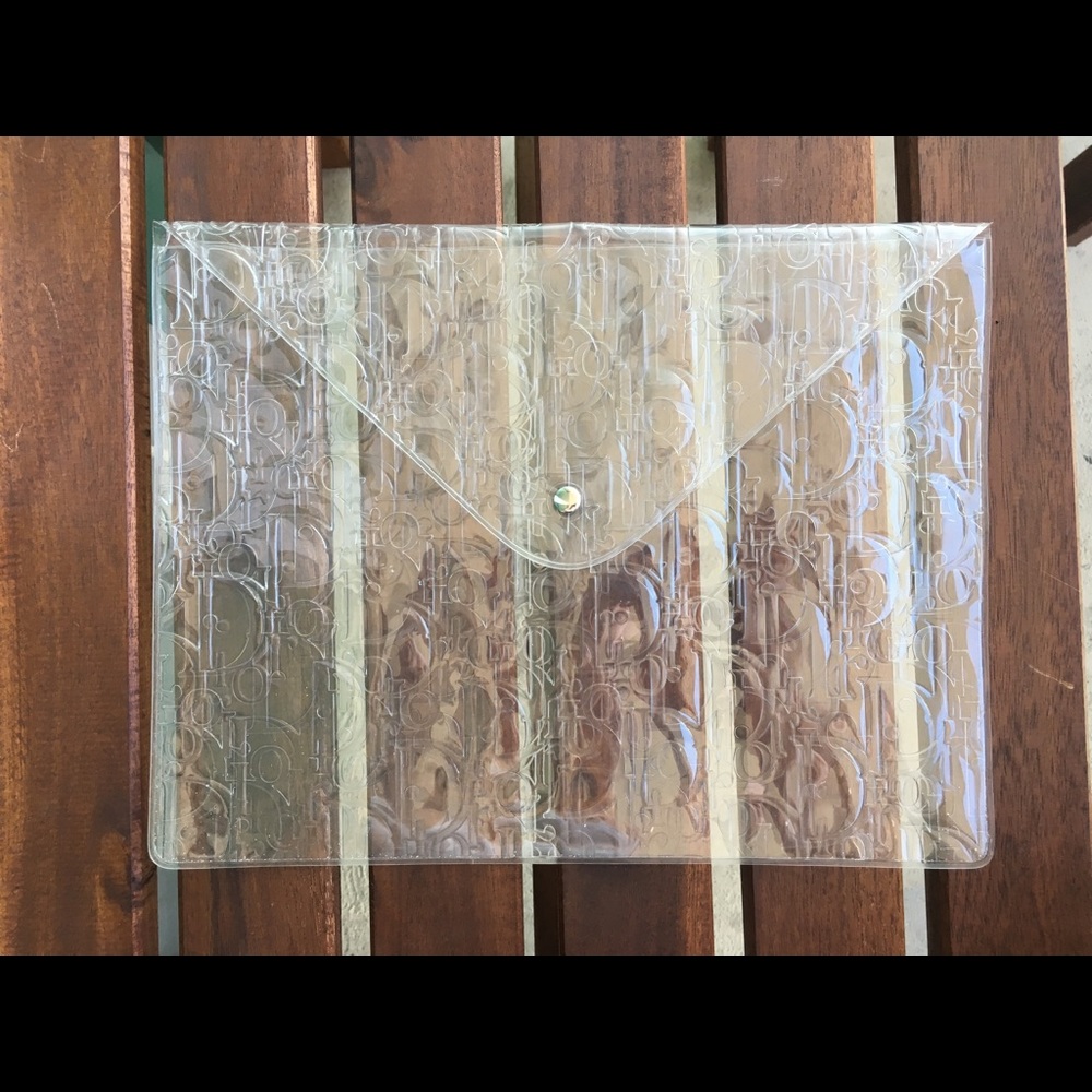 Clear Dior pattern button clutch